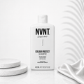 NVNT Ds Hair By Dalia Colour Defence Shampoo Ritual in 400ml bottle, with a sleek label and vibrant color protection design.
