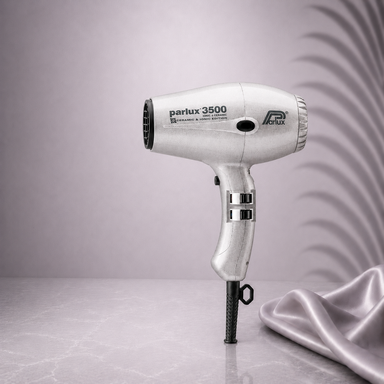 Silver Parlux 3500 Super Compact hair dryer from Ds Hair By Dalia with a sleek, compact design and silver finish.